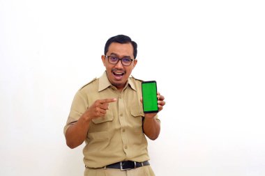 Surprised Indonesian government employees standing while showing blank cell phone display