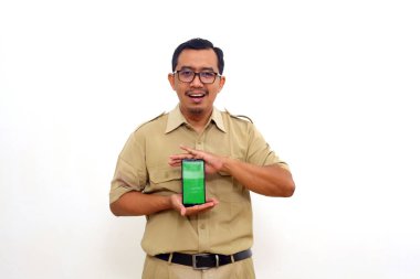 Happy Indonesian government employees standing while showing blank cell phone display
