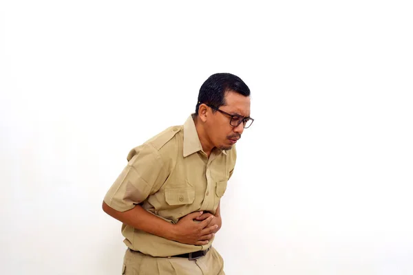 Indonesian government employees suffering from stomach ache. Isolated on white with copyspace