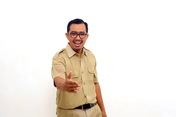 Friendly Indonesian Government Employees Standing While Reach Out Handshake Isolated — 스톡 사진