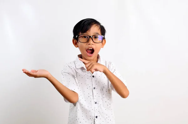 Surprised Asian Boy Standing While Presenting Pointing Empty Space Isolated — Stock Photo, Image