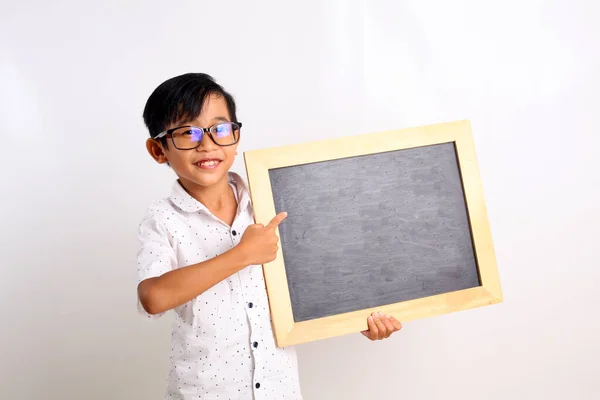 Happy Asian Schoolboy Standing While Showing Blank Blackboard Isolated White — Stock Photo, Image