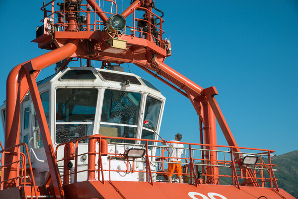 Man cleaning windows of the cockpit 