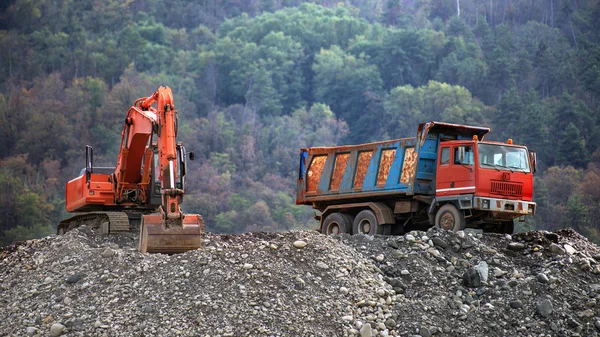 Truck and bulldozer during a break at work — Stock Photo, Image