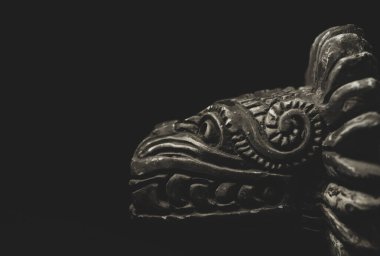 Macro close up photography of a Quetzalcoatl, deity in Aztec culture , means 