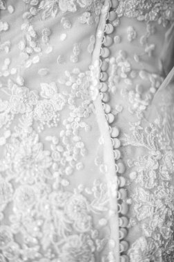 Close up of a wedding dress or bridal gown which is the dress worn by the bride during a wedding ceremony.