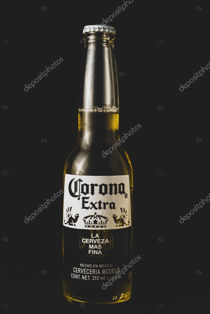 CDMX, Mexico City- Sep 2022Corona extra beer glass bottle,  on black background