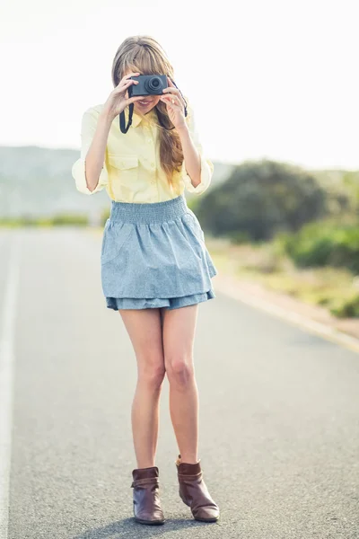 Beautiful stylish photographer taking a picture — Stock Photo, Image