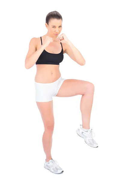 Serious woman in sportswear boxing — Stock Photo, Image