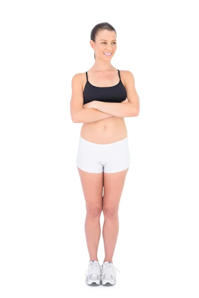 Smiling woman in sportswear crossing arms — Stock Photo, Image