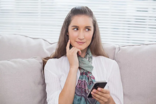 Pensive pretty model text messaging — Stock Photo, Image