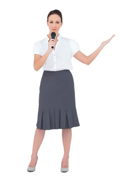 Furious businesswoman shouting in her megaphone — Stock Photo, Image