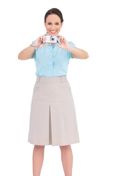 Happy young businesswoman taking picture — Stock Photo, Image