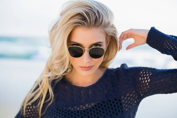 Gorgeous sensual blonde looking over her sunglasses — Stock Photo, Image