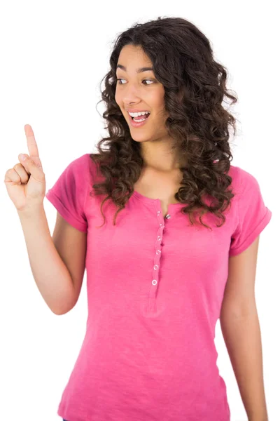 Uśmiechający się brązowe włosy kobieta palcem — Zdjęcie stockowe