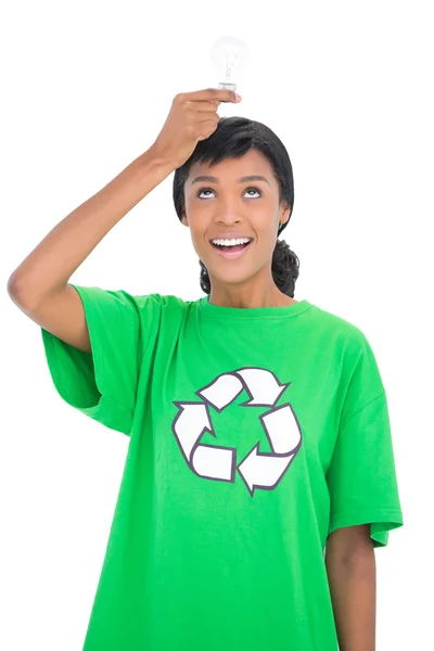 Content black haired ecologist holding a light bulb — Stock Photo, Image