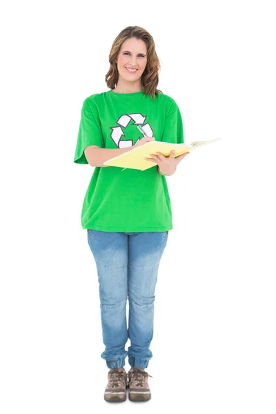 Smiling environmental activist writing — Stock Photo, Image