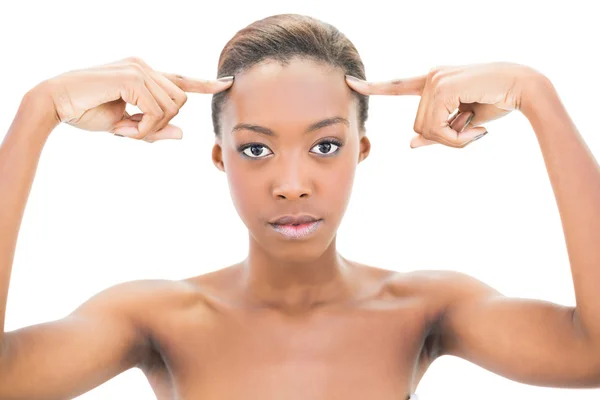 Natural beauty pointing at forehead — Stock Photo, Image