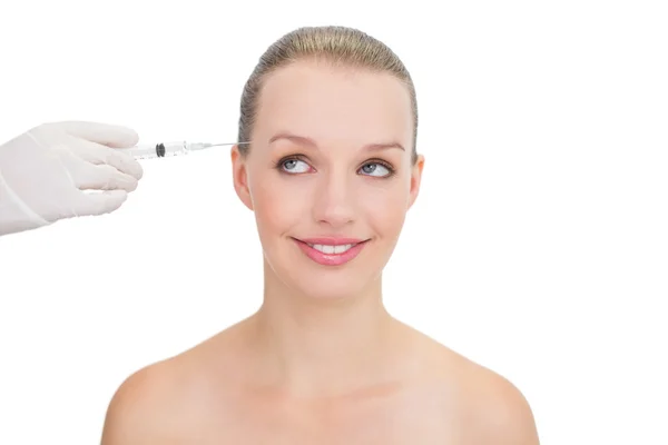 Thoughtful pretty blonde model receiving botox injection — Stock Photo, Image