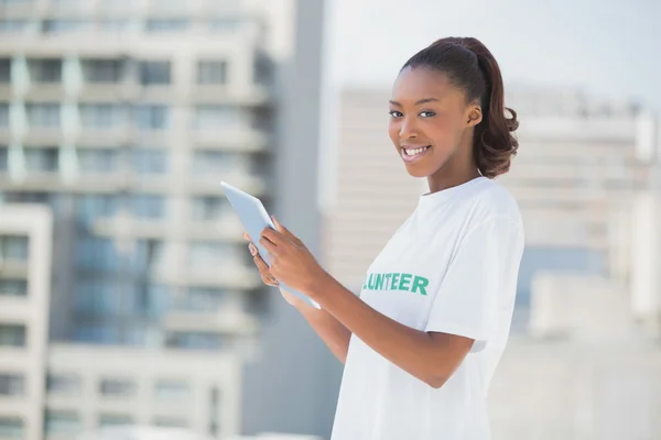 Sweet smiling girl using tablet pc — Stock Photo, Image