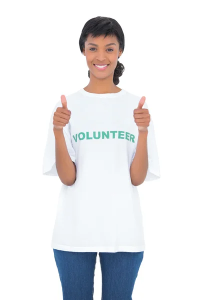 Charming black haired volunteer giving thumbs up — Stock Photo, Image