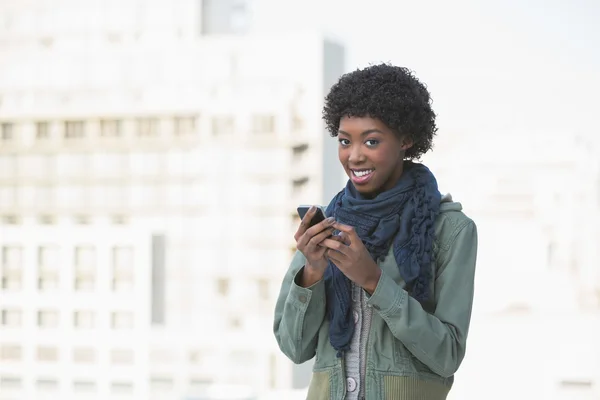 Cheerful afro model texting — Stock Photo, Image