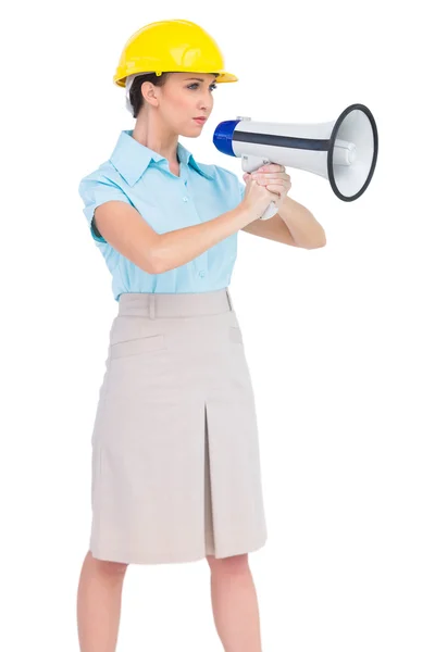 Stern attractive architect holding megaphone — Stock Photo, Image