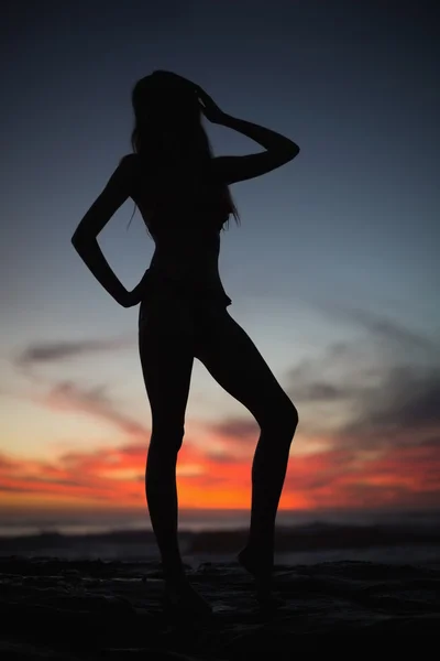 Silhouette of gorgeous woman on sea background — Stock Photo, Image