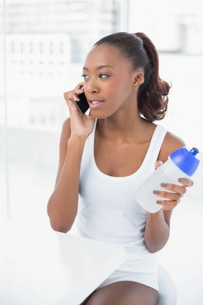 Peaceful athletic woman on the phone — Stock Photo, Image