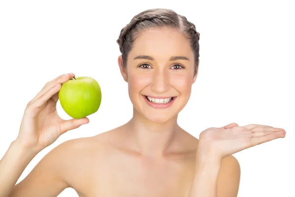 Happy healthy model holding green apple — Stock Photo, Image