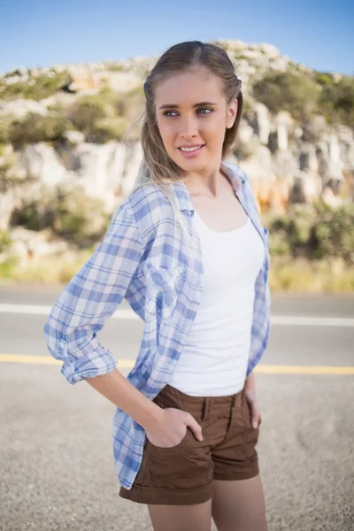 Woman with hands in pockets looking away — Stock Photo, Image