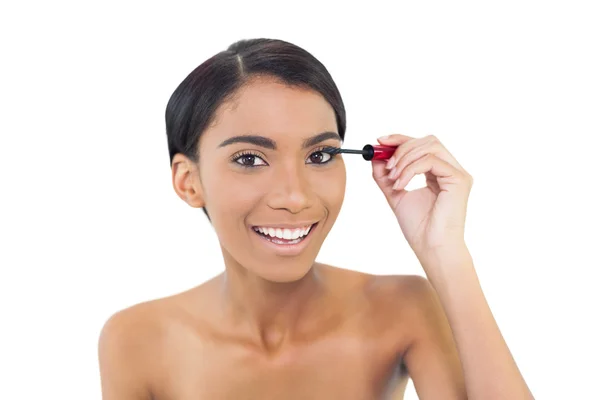 Pretty natural model applying mascara — Stock Photo, Image