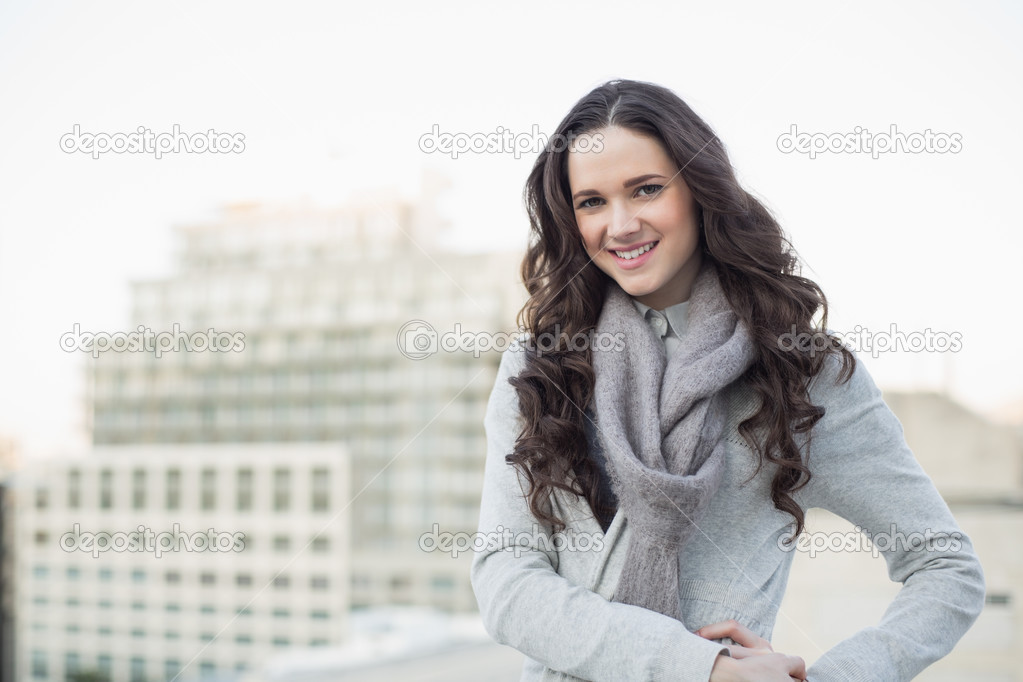 Pretty brunette in winter clothes posing