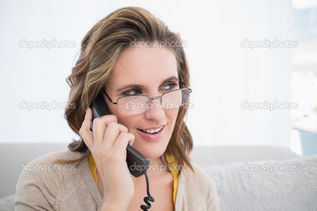 Cheerful woman talking on the telephone