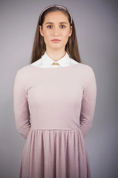 Serious pretty model with pink dress on posing — Stock Photo, Image