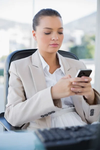 Peaceful sophisticated businesswoman texting — Stock Photo, Image