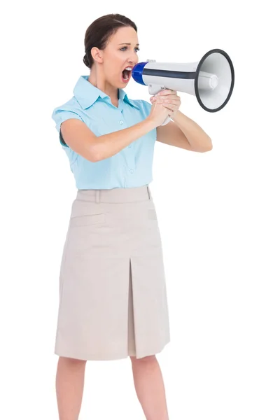 Angry classy businesswoman shouting in her megaphone — Stock Photo, Image