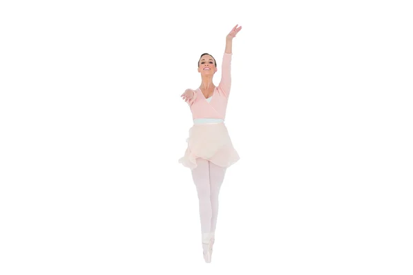 Smiling ballerina with her arms extended — Stock Photo, Image