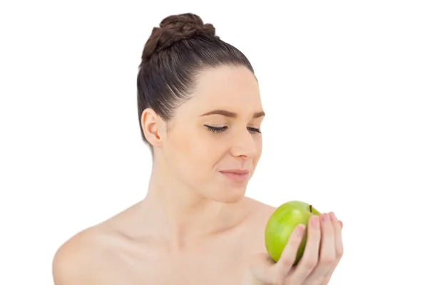 Peaceful pretty model holding apple — Stock Photo, Image