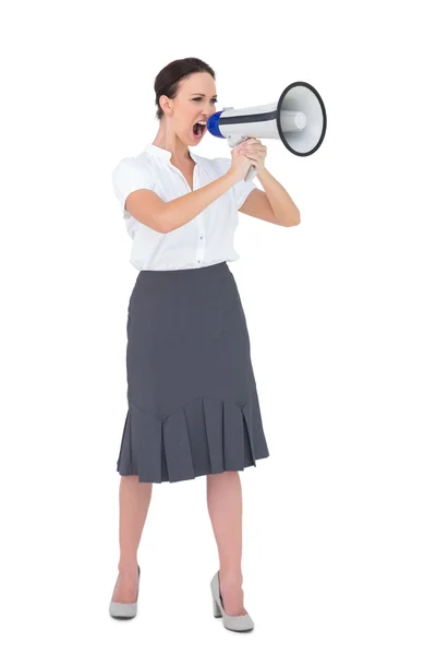 Furious businesswoman shouting in her megaphone — Stock Photo, Image
