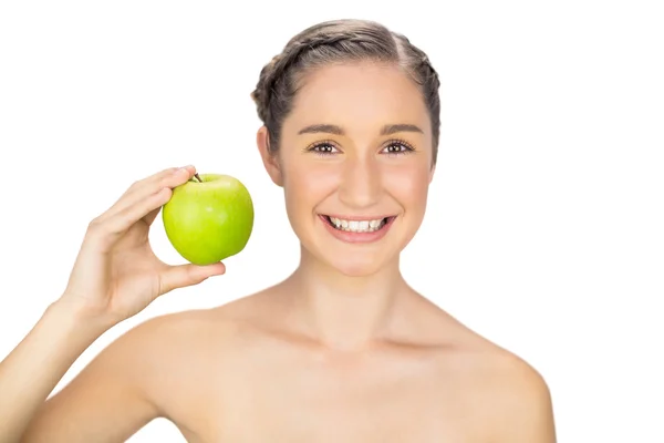 Cheerful healthy model holding green apple — Stock Photo, Image