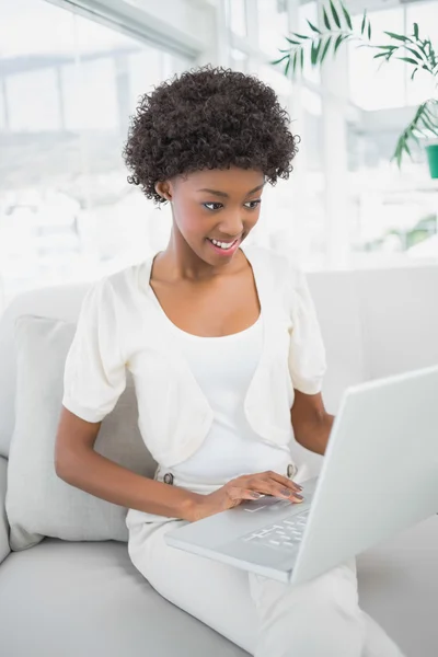 Focused gorgeous woman using laptop — Stock Photo, Image