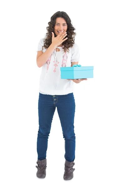 Cheerful casual brunette receiving a present — Stock Photo, Image