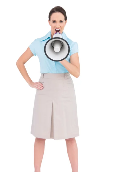 Furious classy businesswoman talking in megaphone — Stock Photo, Image