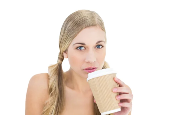 Serious young blonde woman drinking coffee — Stock Photo, Image