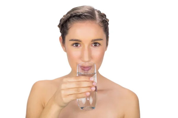 Smiling young model drinking water — Stock Photo, Image