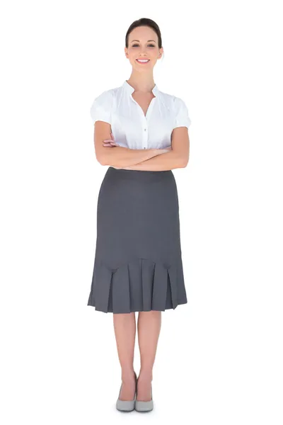 Cheerful businesswoman posing crossing arms — Stock Photo, Image