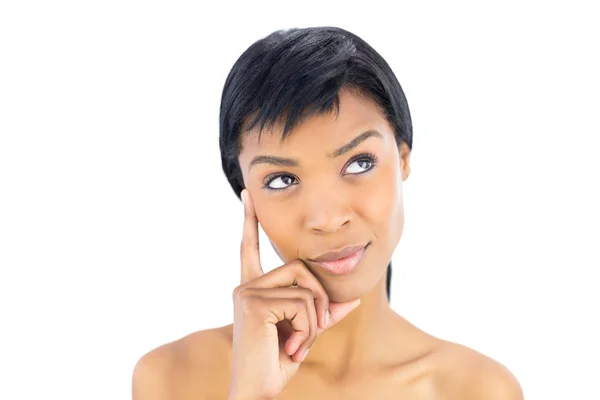 Wondering black haired woman posing looking away — Stock Photo, Image