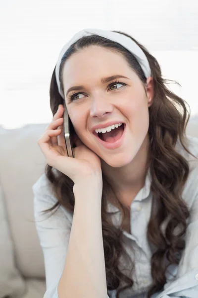 Pretty casual woman being astonished on the phone — Stock Photo, Image