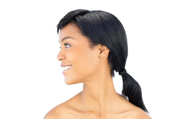 Profile view of a joyful black haired woman posing looking away — Stock Photo, Image